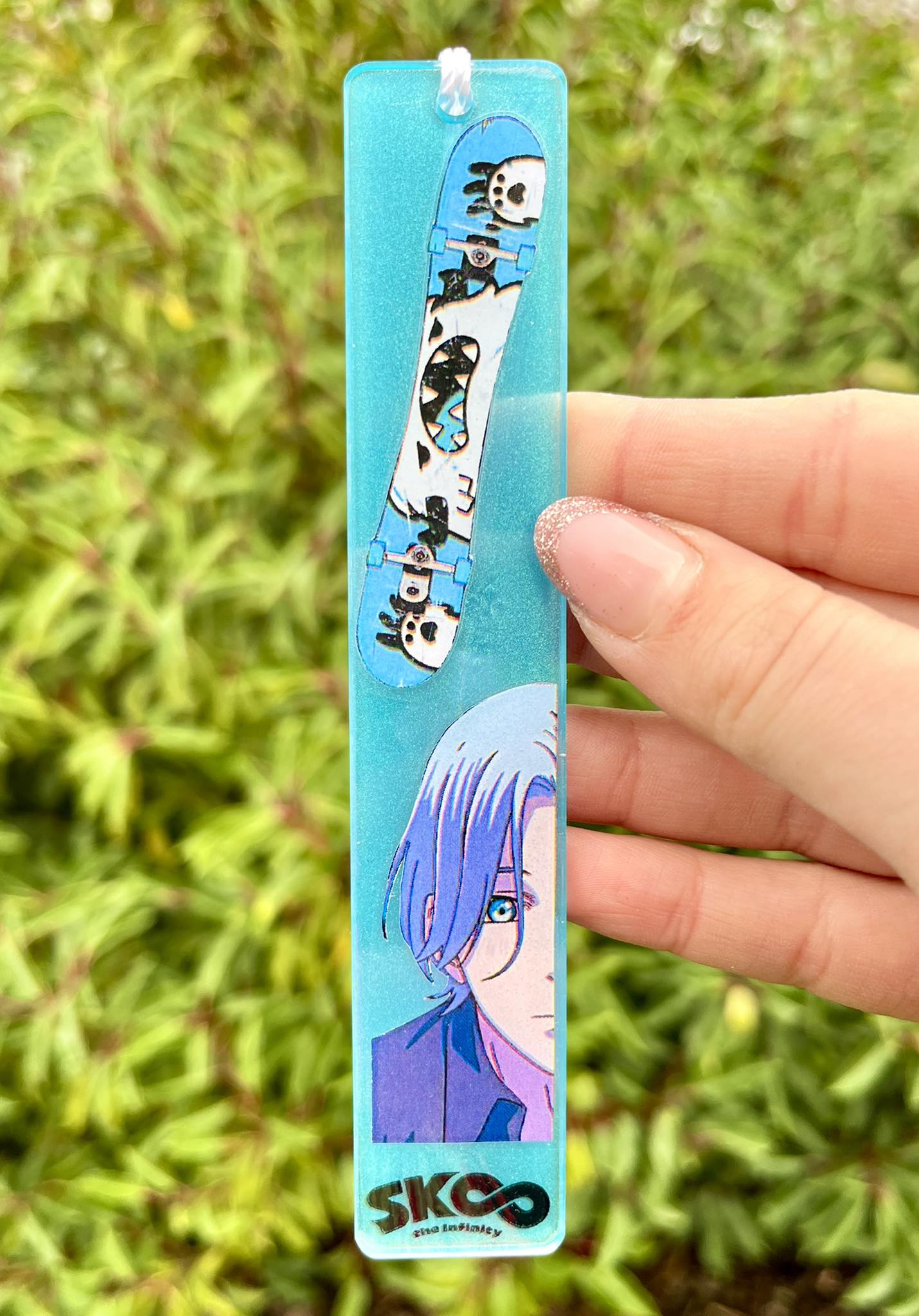 Blue haired skaterboi resin bookmark