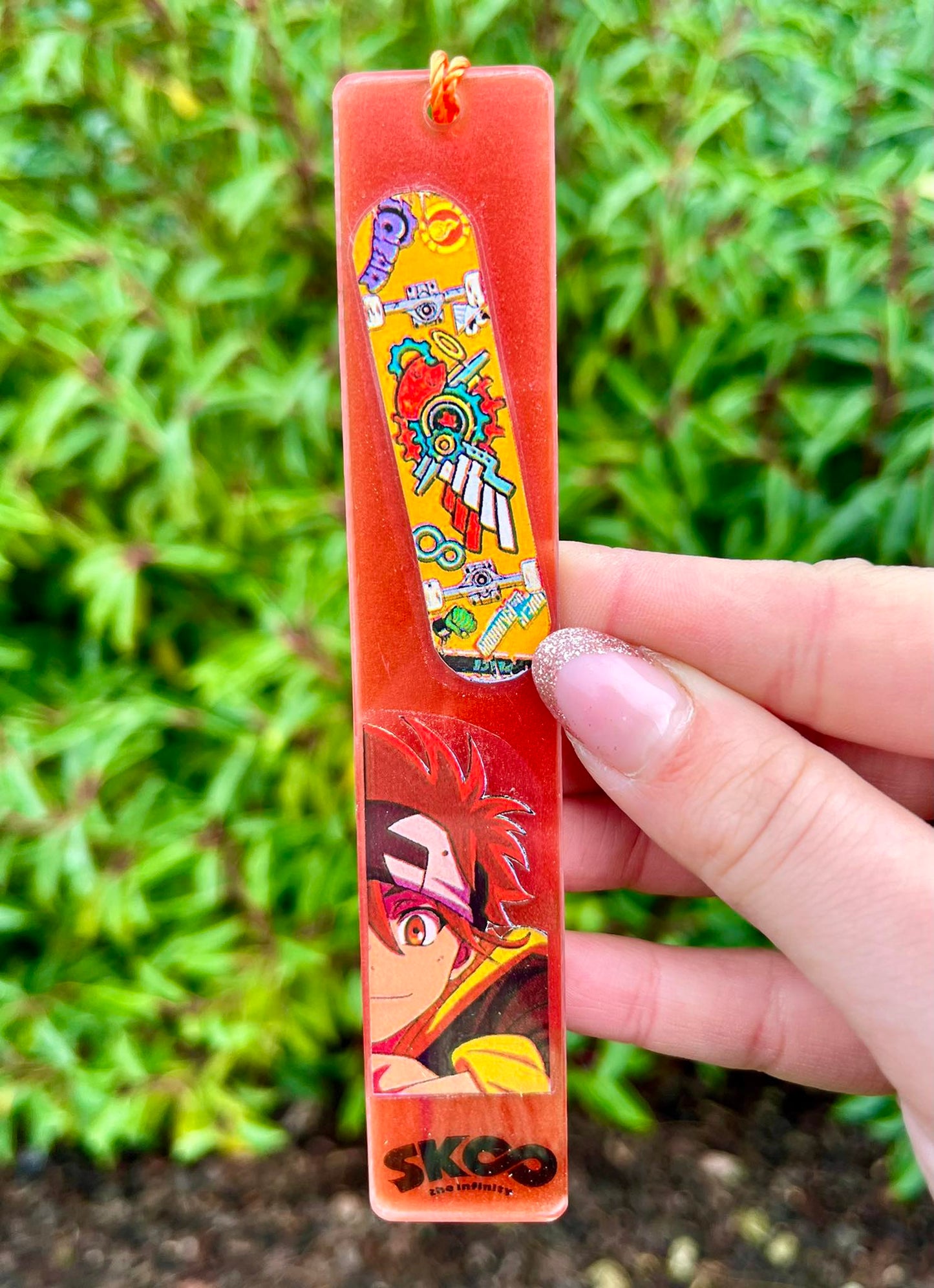 red haired skaterboi resin bookmark